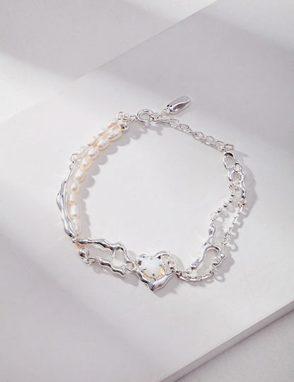 Fluid design sterling silver pearl bracelet